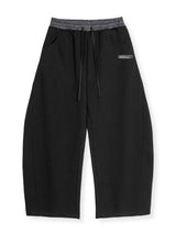 PANTALONI DI TUTA CON ELASTCO IN VITA A QUADRI E GAMBA CURVA STREETWEAR